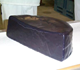 A cheese block that has been enrobed with wax using the ChocoMa enrober