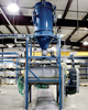A filter-receiver with reverse- pulse filter cleaning continuously and efficiently separates the powder from the vacuum pneumatic system, dropping process feed into the wet mixer. 